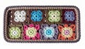 Colorful Crochet Squares in Rectangular Tray with Neutral Border and Bright White Background Royalty Free Stock Photo