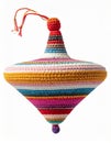 Colorful Crocheted Decorative Spinning Top with Horizontal Stripes on White Background Royalty Free Stock Photo