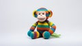 Colorful Crocheted Monkey Toy On White Background