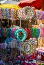 Colorful crowns for sale made of fake flowers Royalty Free Stock Photo