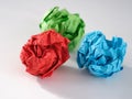 Colorful crumpled paper balls on a gray background Royalty Free Stock Photo