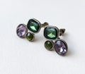 Colorful crystal vintage earrings on beige background, statement retro jewelry for women