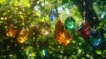 Colorful Crystals Suspended on Fine Strings Against a Lush Green Forest Backdrop