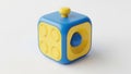 Colorful cube toy with yellow and blue sections Royalty Free Stock Photo