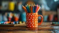 Tableware item, cup filled with colored pencils, resting on a wooden table Royalty Free Stock Photo