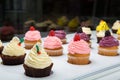 Colorful cupcakes with different Tastes. Small beautifull cakes on white table top.