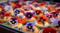 Colorful cupcakes with edible flowers on a decorative tray for a delightful treat Royalty Free Stock Photo