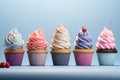 Colorful cupcakes on a pastel background. Generative AI Royalty Free Stock Photo