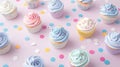 Colorful cupcakes with pastel frosting and sprinkles arranged on a polka-dotted pink background, presenting a cheerful and sweet Royalty Free Stock Photo