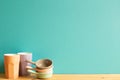 Colorful cups and bowls on wooden table Royalty Free Stock Photo