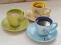 Colorful cups with hot coffee, cappuccino and tea. Set with different cups of coffee and tea Royalty Free Stock Photo
