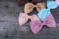 Colorful and cute ribbon bows for girls , on dark wooden background