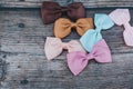 Colorful and cute ribbon bows for girls , on dark wooden background