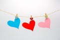 Colorful cutting paper hearts hanging rope with wooden clip for Happy Valentine`s Day