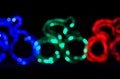 Colorful cyclist shape bokeh lights