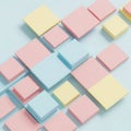 Colorful 3 D Cubes in Pink Yellow and Light Blue Arranged in a Grid Pattern on a Light Blue Background Royalty Free Stock Photo