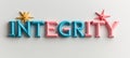 Colorful 3D Integrity Sign With Starbursts On Each Side Against A Clean White Backdrop Royalty Free Stock Photo