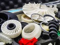 Colorful 3D printed gears and components displayed on a table at an exhibition for innovative manufacturing technologies Royalty Free Stock Photo