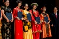 Colorful dancers with award in costume
