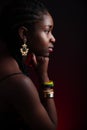 Colorful and dark side view portrait of native african woman Royalty Free Stock Photo