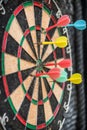 Colorful dart target game with one win arrow hit on middle point spot and many missing for competitive business marketing concept