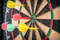Colorful dart target game with one win arrow hit on middle point spot and many missing for competitive business marketing