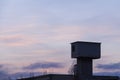 Colorful dawn/dusk sky over an abandoned industrial building.