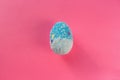 Colorful decorated blue easter egg on pink pastel color background with copyspace. Easter concept, greeting card Royalty Free Stock Photo