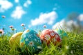 colorful decorated easter eggs in the grass on blue sky background. Easter concept Royalty Free Stock Photo