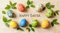 Colorful decorated easter eggs with green leaves on neutral background Happy Easter Royalty Free Stock Photo