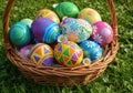 Colorful decorated easter eggs in a wicker basket isolated on white background Royalty Free Stock Photo