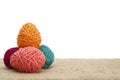 Colorful decorated easter eggs from wool yarn. Royalty Free Stock Photo