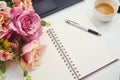 Colorful decoration artificial flower ,pen and blank notebook on white background , top view , copy space for text Royalty Free Stock Photo