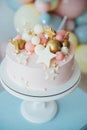 Colorful decoration of a first year birthday cake