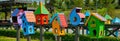 Colorful decorative birdhouses for birds on the street in the Park. Art object birdhouses