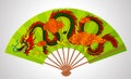 Colorful decorative Chinese open fan with flying dragon and clouds isolated on white Royalty Free Stock Photo