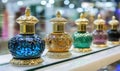 Colorful decorative perfume bottles displayed elegantly, intricate designs, luxurious Royalty Free Stock Photo
