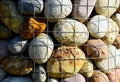 Colorful decorative smooth river stone closeup in galvanized wire mesh cage Royalty Free Stock Photo