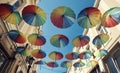 Colorful decorative umbrellas hanging over in the city