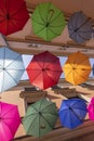 Colorful decorative umbrellas hanging over Piekarska street near Town Square, Tarnow, Poland