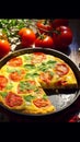 Colorful delicious Frittata. Very contrasty light is bringing the depth and vibrancy of this tasteful dish. Royalty Free Stock Photo