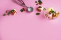 Colorful delicious ice cream on a pink background, with spices, mint leaves