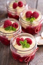 Colorful and delisious dessert in a jar berry cramble