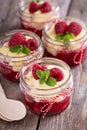 Colorful and delisious dessert in a jar berry cramble