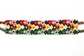 Colorful designer unique friendship bracelet handmade of threads with bright pattern isolated on white background