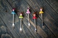 Colorful Dessert Forks with Colorful Trinket Handles on Blue Royalty Free Stock Photo