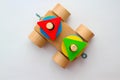 Top view wooden train on the white background. The colorful details of plaything draw the attention of the baby.