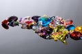 Colorful of different gemstones with space for text on gray back Royalty Free Stock Photo