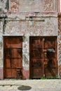 Colorful and Dilapidated Wall and Rusty Metal Doors