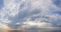 Colorful dinamic sunset sky with clouds above sea beach background. Atmosphere cloudscape skyline